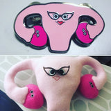 Pink uterus and ovaries as a plush and pin 