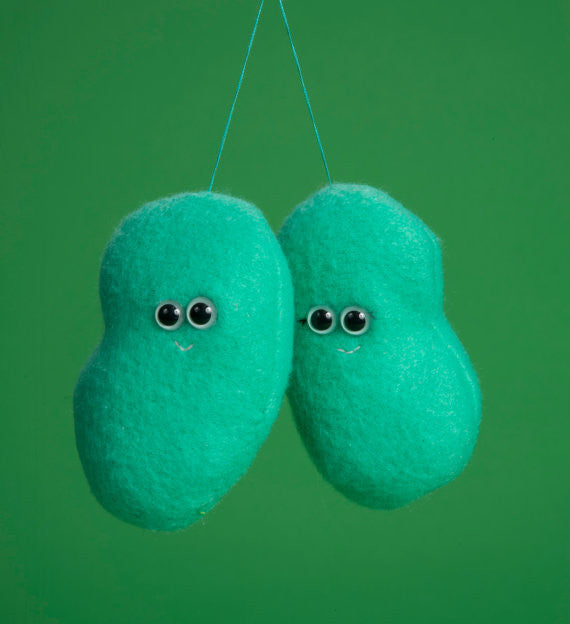 Two green plush lymph nodes